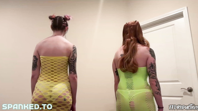 Sensual Lesbian Couple Explore Their Kinky Side with Some Spanking Fun in Matching Yellow Outfits.